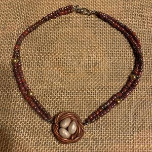 Necklace with bird nest